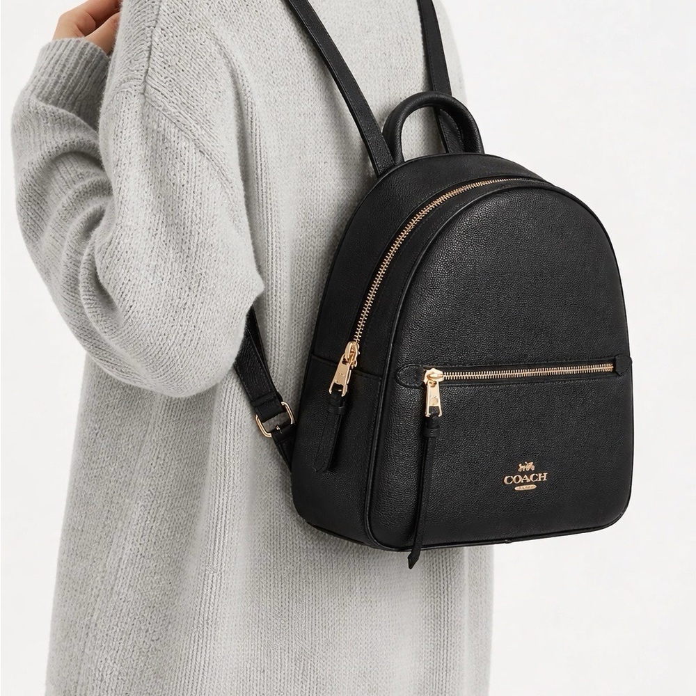 Coach Elegant Black Backpack with Gold Details